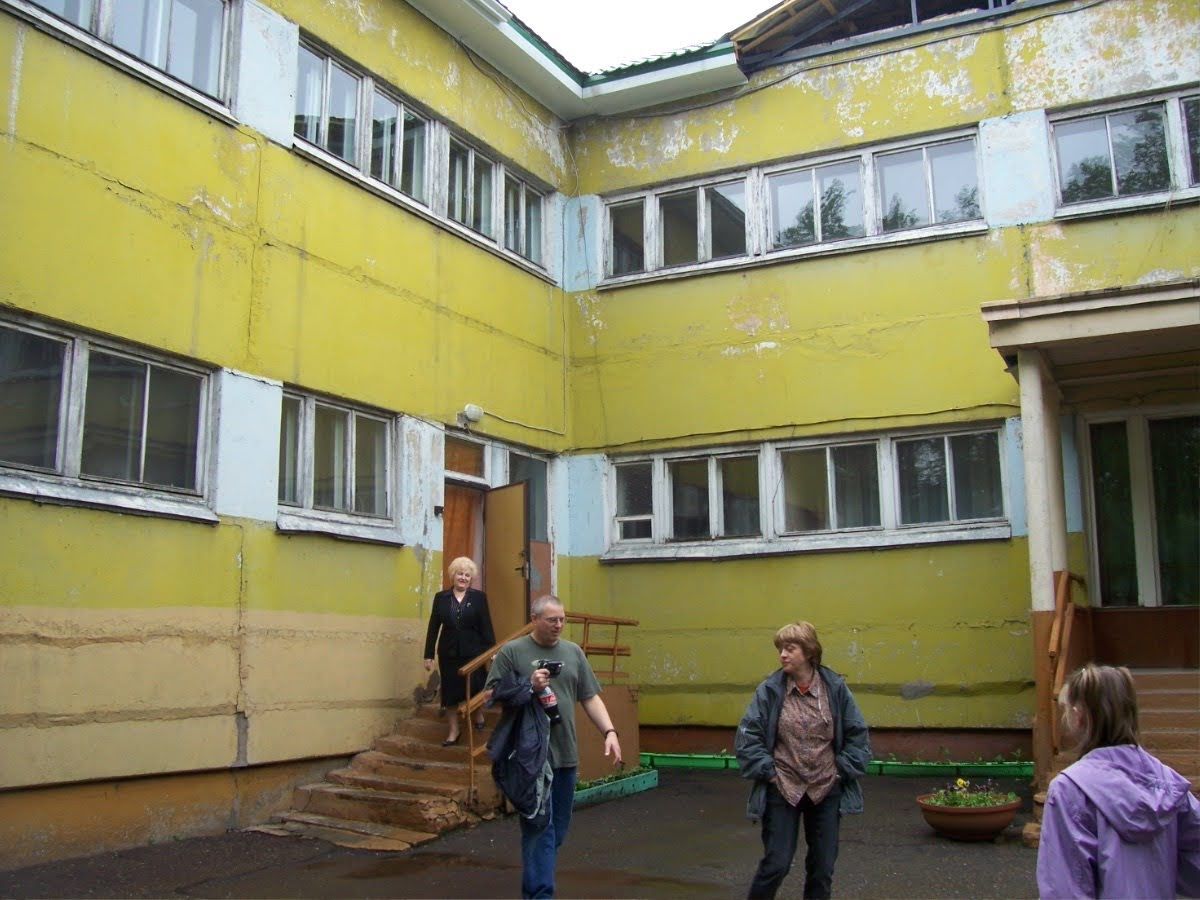 This photo was taken after Masha said her final goodbyes to her friends at the orphanage. This picture captures Masha's last look at the orphanage before leaving for the US.