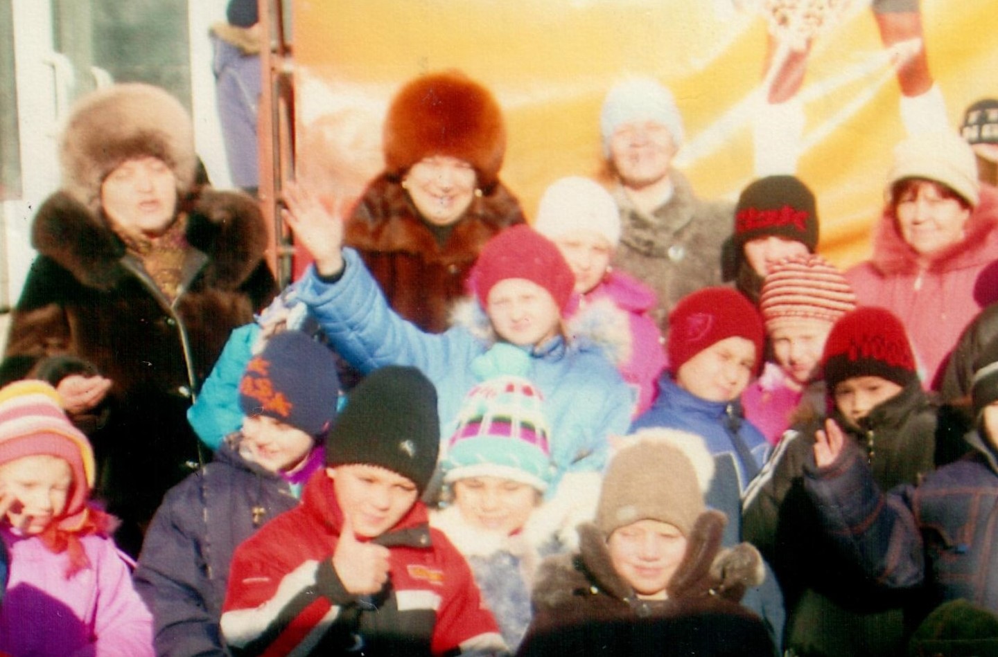 The orphanage sometimes received sponsorship funds, allowing the caretakers to bring the children on fun outings to places like the zoo. Masha is seen here waving at the camera when the orphanage went to the circus.