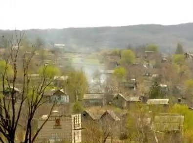 The Russian word 'деревня' (derevnya) means rural countryside or village. This photo was taken in Masha's hometown of Ussuriysk, which is a combination of rural derevnya and urban city.
